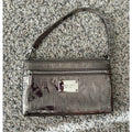 The City Lights Metallic Wristlet by Michael Kors