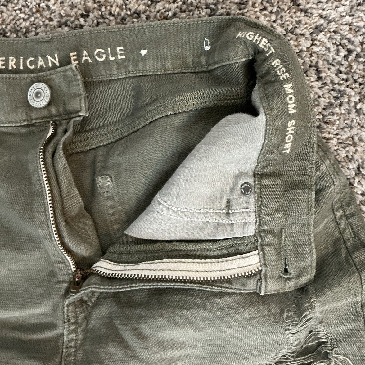 Green shorts with 'American Eagle' branding on a textured surface