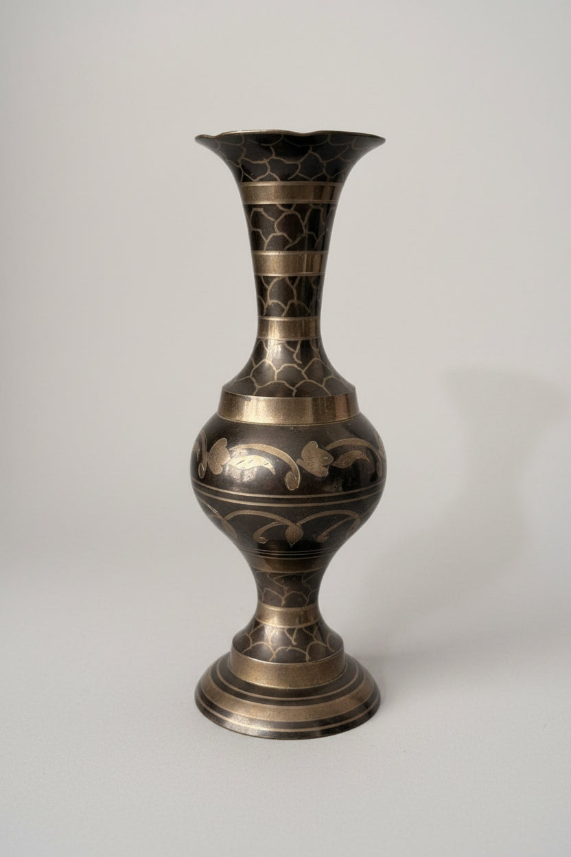 Decorative vase with intricate patterns on a textured surface