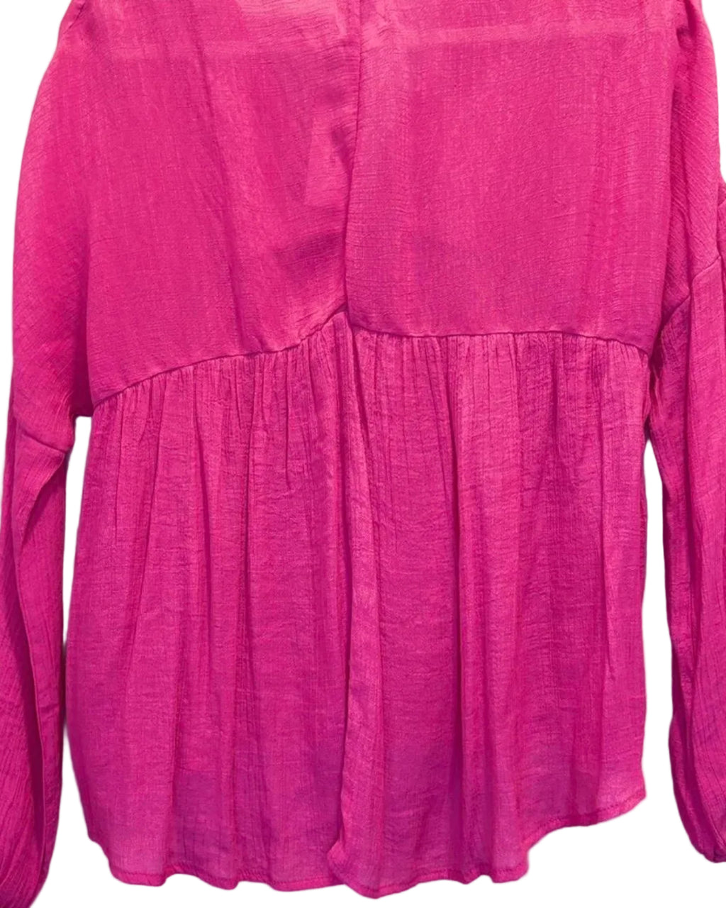 Back of pink flowy blouse on a white background
