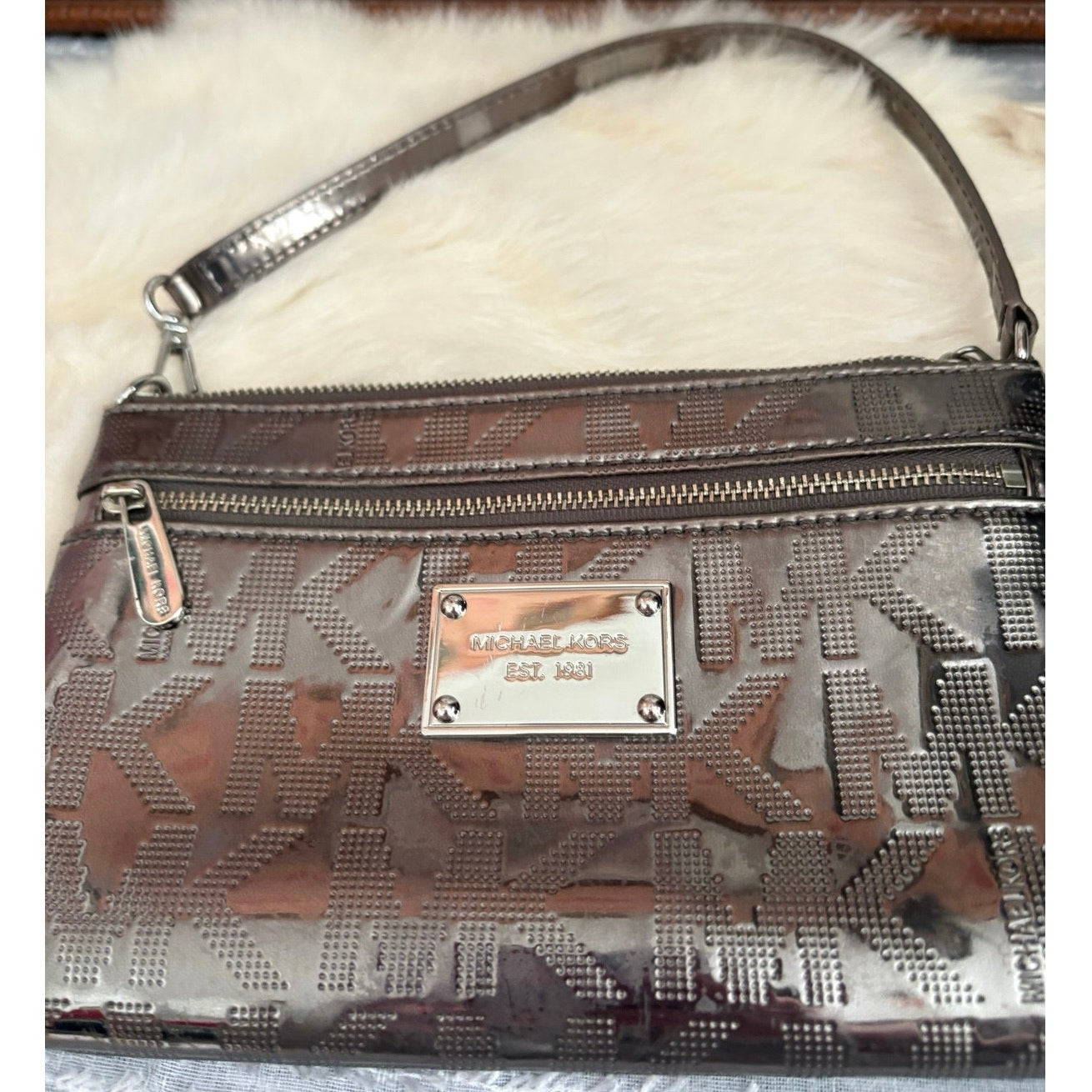 The City Lights Metallic Wristlet by Michael Kors