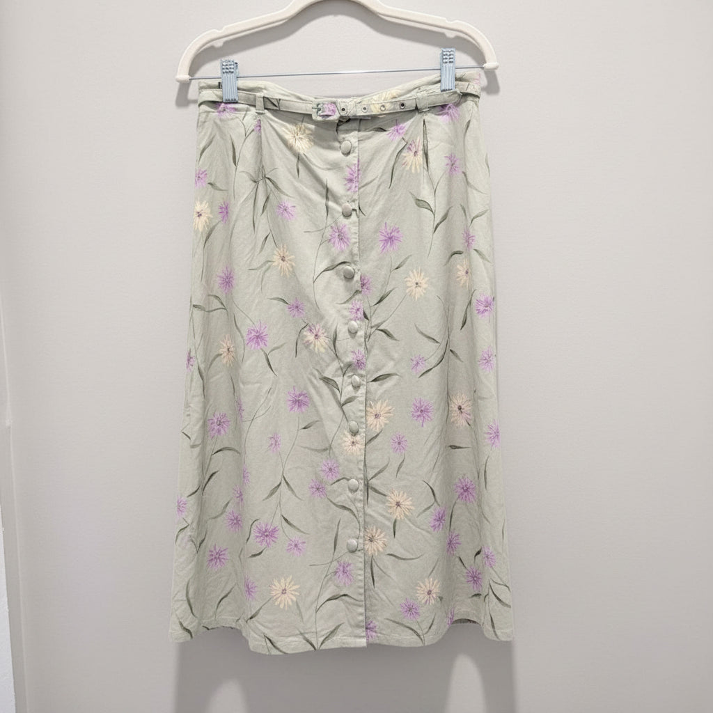 Floral-patterned maxi skirt hanging against a white background