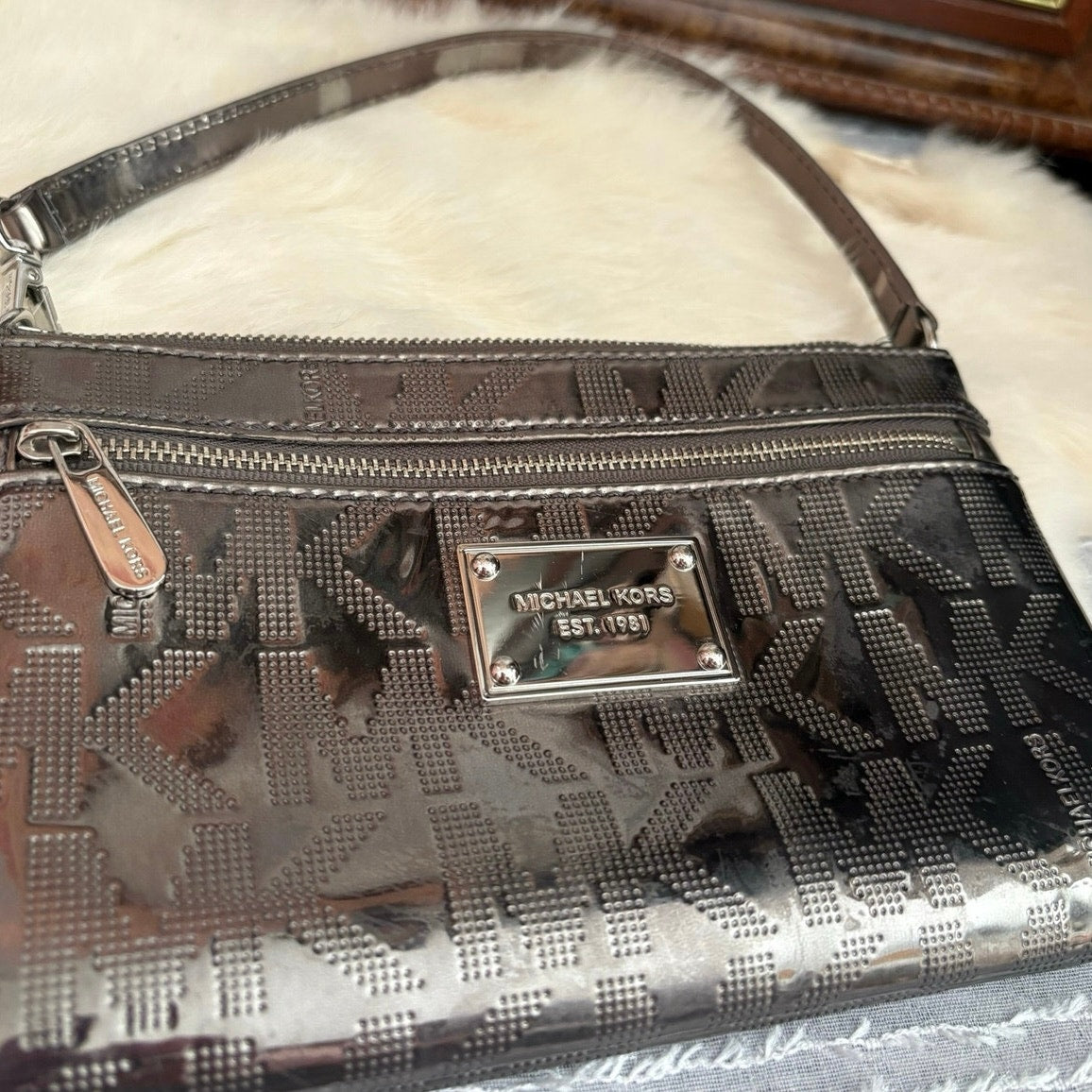 The City Lights Metallic Wristlet by Michael Kors