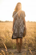 Black and white patterned dress on a model, bohemian aesthetic