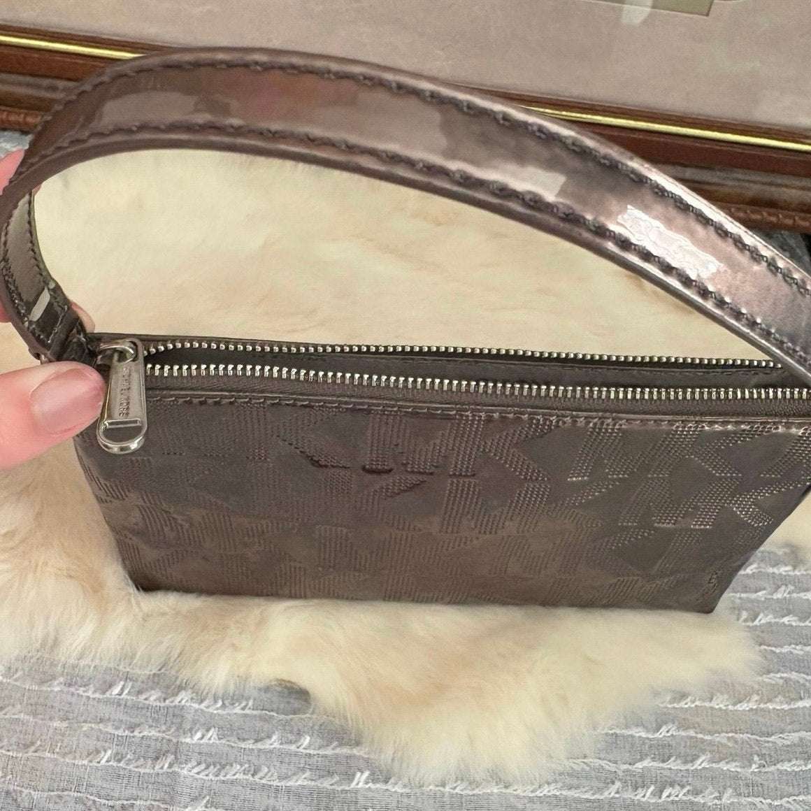 The City Lights Metallic Wristlet by Michael Kors